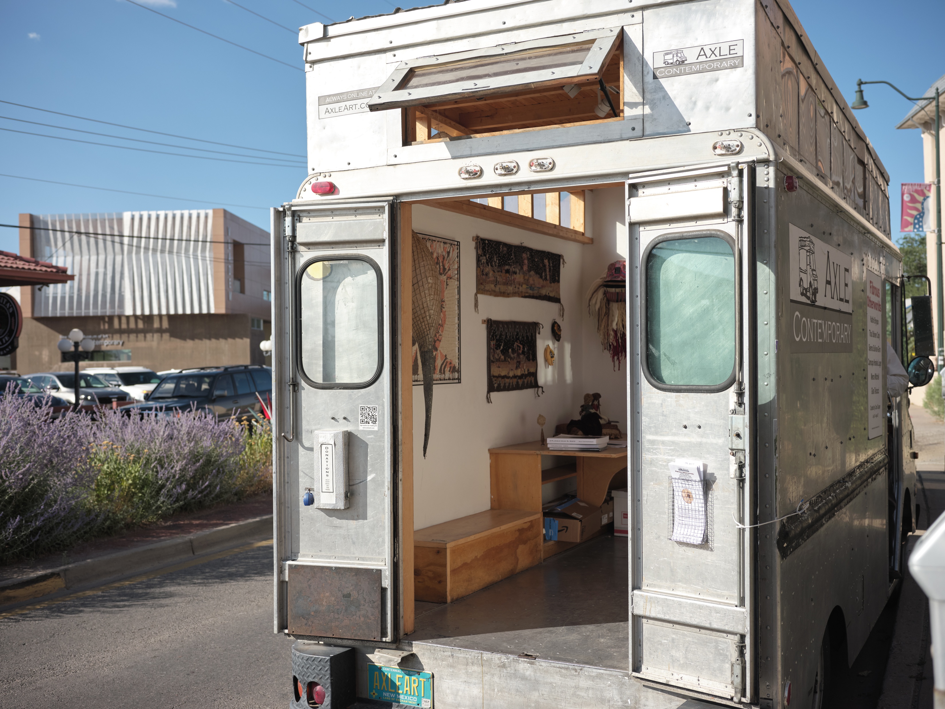 Silver van converted into art gallery