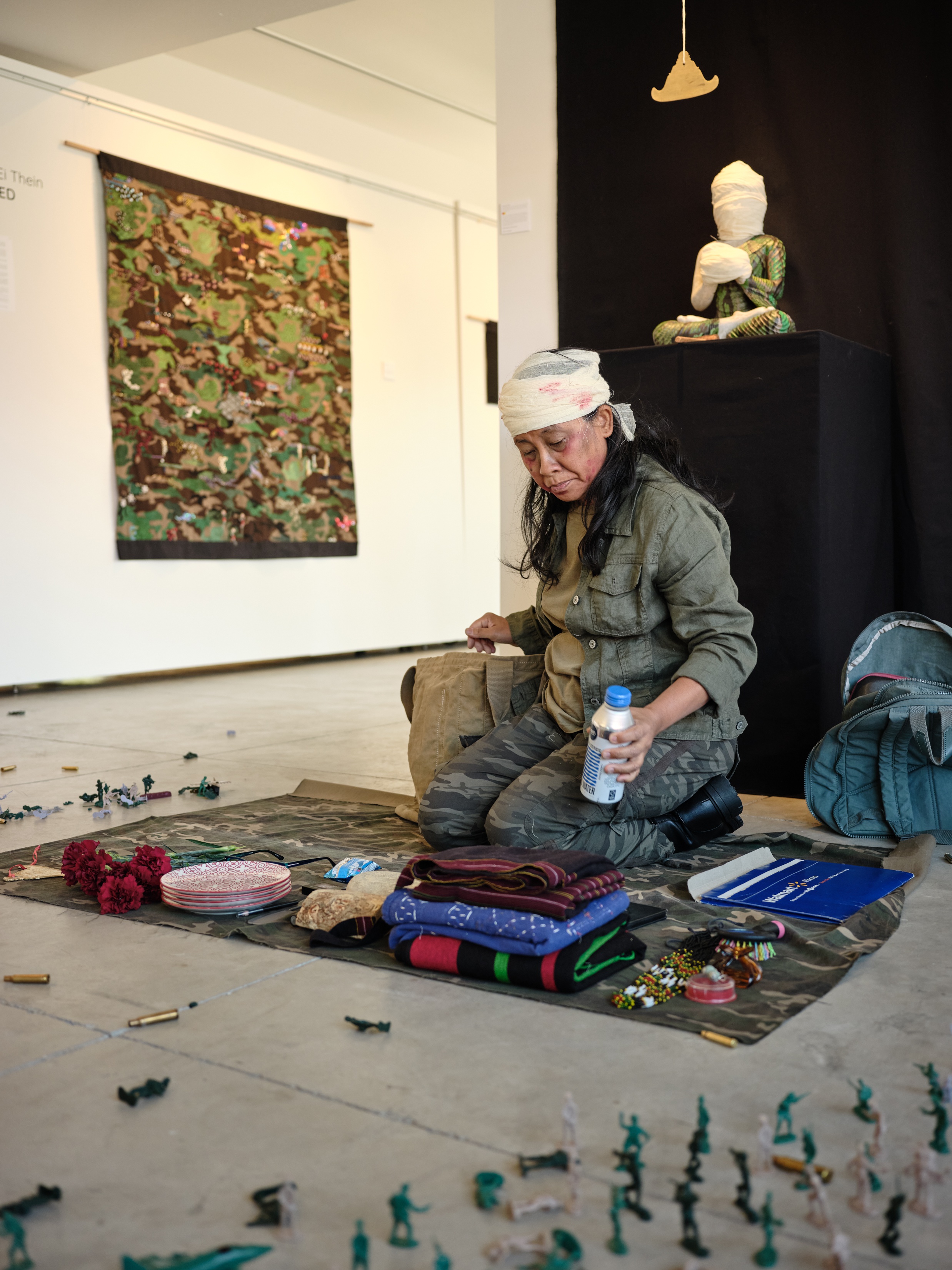 Artist unpacks backpack