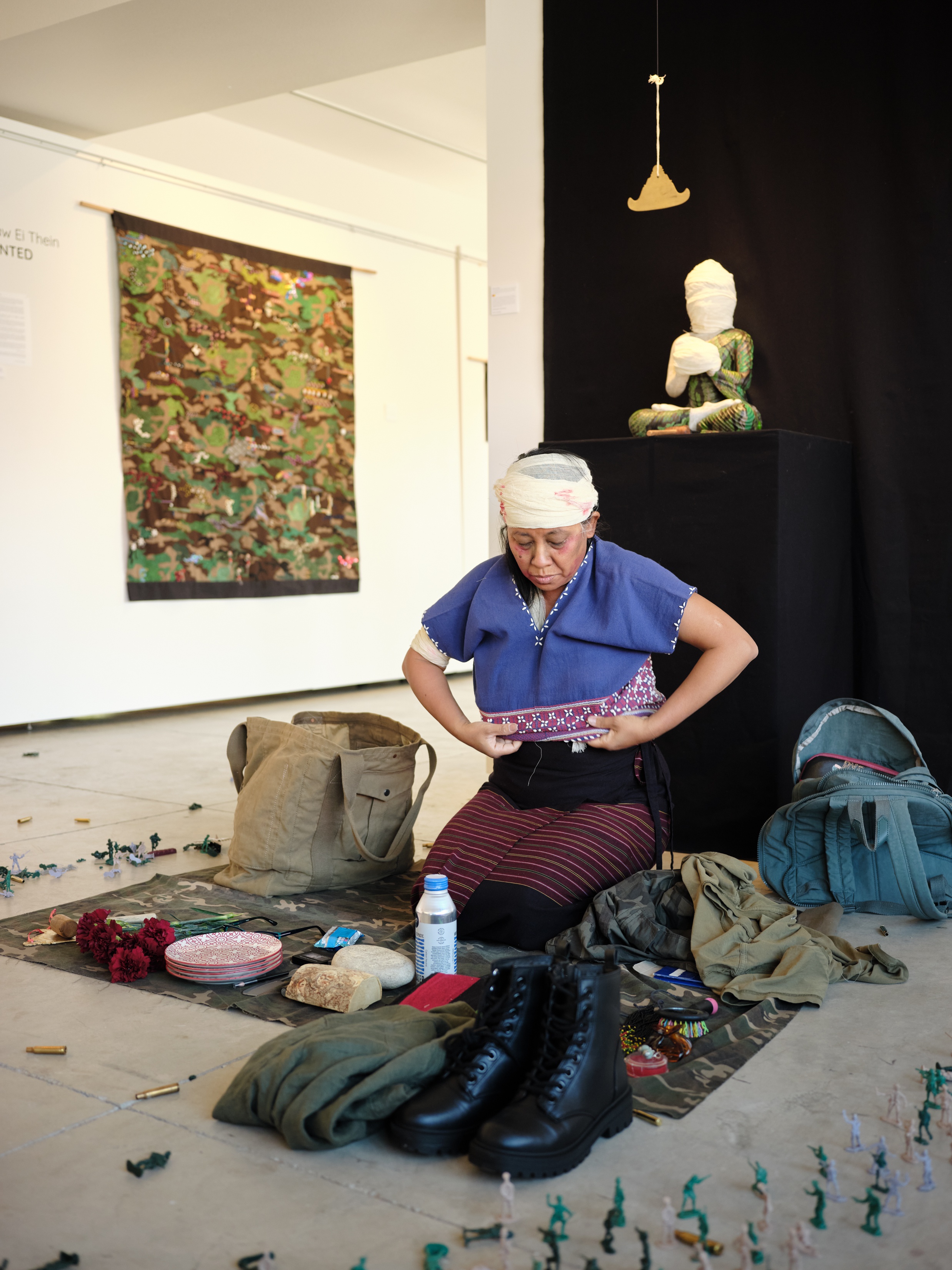 Artist dresses in traditional Burmese garment